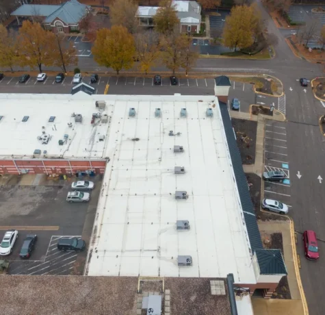Interior ceiling water stain signalling commercial roof leak
